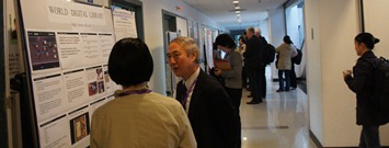 The author at the front of the poster presentation